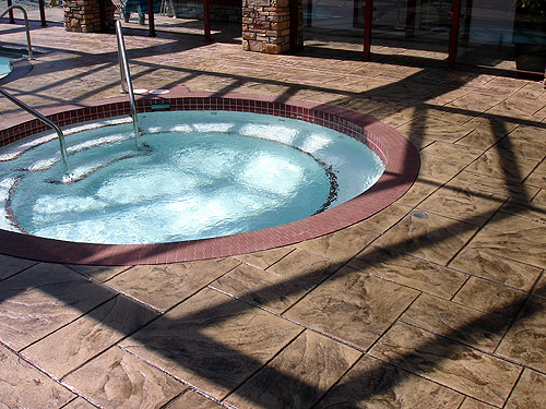 Large Ashler with Stone Skin Border Stamped Concrete Pool